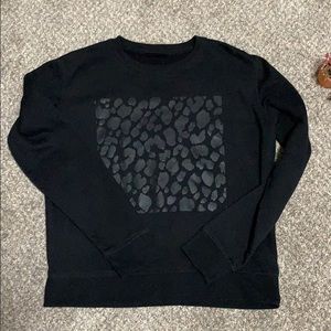 Black sweater with cheetah print design